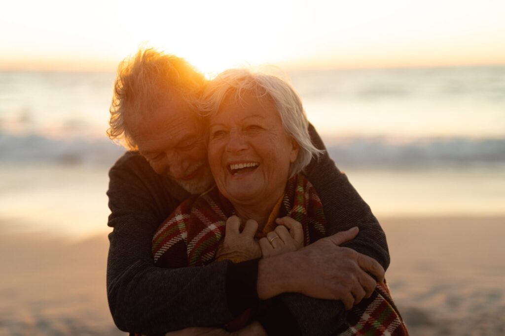 Old couple in love at the beach