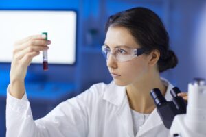 Female Scientist doing Blood Test