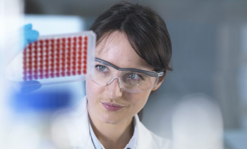 Scientist preparing blood samples for clinical testing in laboratory